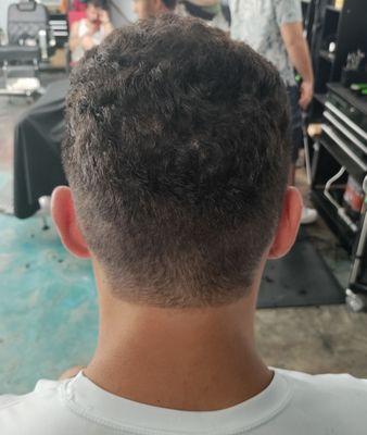 Mid-fade/taper cut by Aaron ($25)