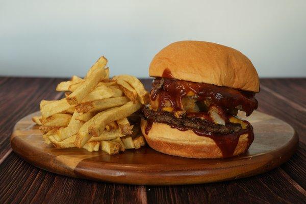 1/2 Pound Ribeye Burger, Cheddar Cheese, Smoked Applewood Bacon, Shoestring Onions, BBQ Sauce on a Fresh Baked Bun.