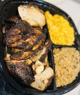 Jerk chicken dinner with rice and peas and Mac and cheese