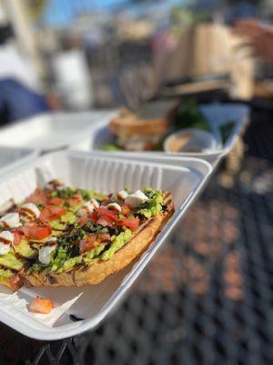 Caprese toast- avocado spread with tomato, fresh basil, mozzarella, balsamic drizzle