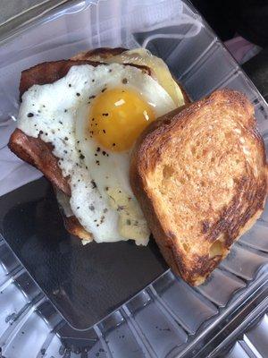 Bacon egg and cheese on milk bread with aioli