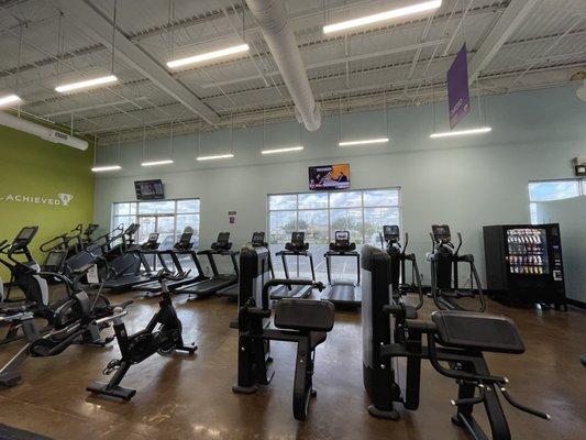 Cardio equipment faces front entrance. Mirrors are private so folks outside can't see you. Vending machine has water, protein shakes etc.