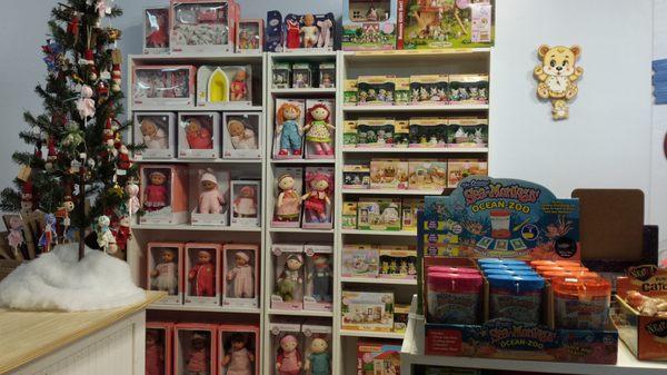 We carry Corolle dolls, soft dolls by HABA, and a variety of Calico Critters sets.