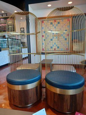 Bird cage chairs highlight the uncomfortable furniture in this establishment.