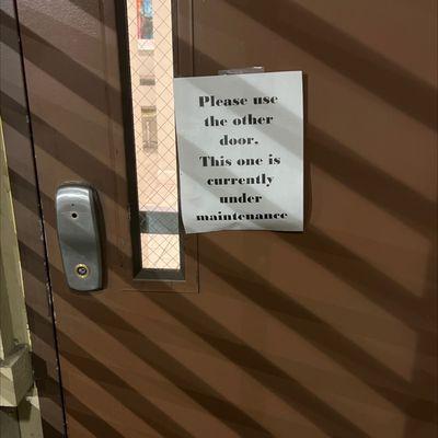 broken doors leading to an unsecured building