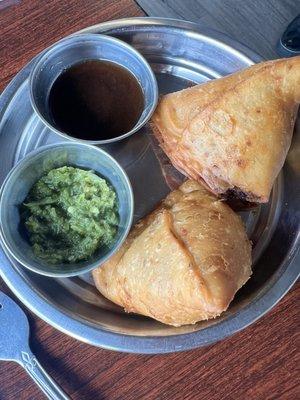 Veggie samosa with tamarind and mint chutneys