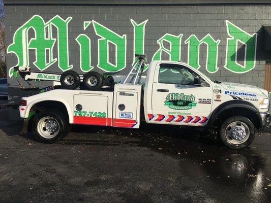 One of Midland's Tow Trucks in front of building