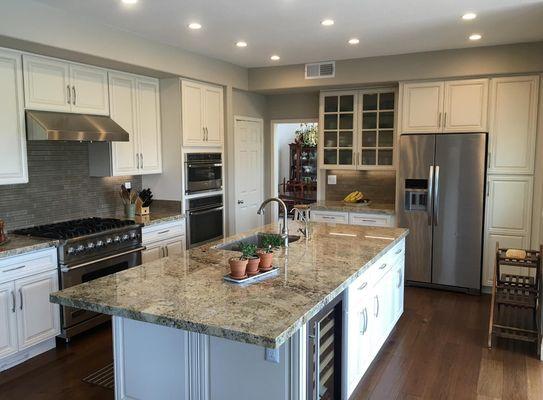 Custom kitchen, wine area & Fireplace