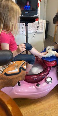 Kid pedicure being done