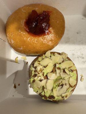 Raspberry filled doughnut and pistachio blueberry doughnut