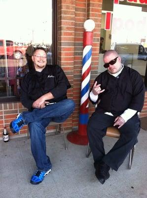 Nathan Sloss and Steve Boone, two of our employees sitting outside the shop near our barber pole.