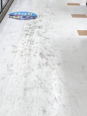 The floor in front of the dairy cases.