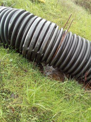 Poorly installed culvert failing. Bad work