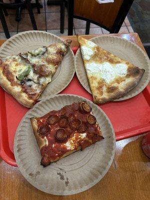 grandma slice with pepperoni cups, supreme style slice and a white slice