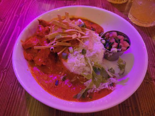 Butter chicken with the random addition of pico de gallo and tortilla strips