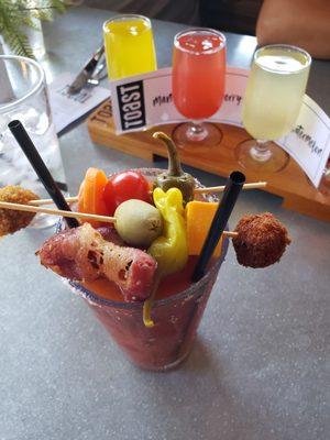 Amazing bloody Mary with fried meatball, fried blue cheese olive, pickled veggies, cheese and bacon