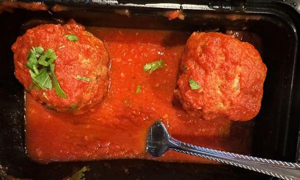 Side of meatball. Tasty but dense. Sauce is great!