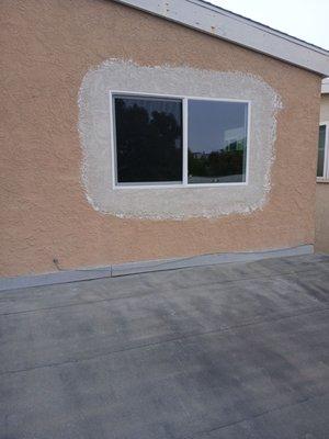 Cut Down of window for bedroom egress with new nail fin vinyl windows Seal Beach, CA outside view.