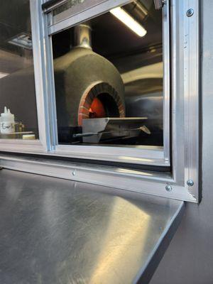 An authentic Mugnaini wood fired oven imported from Tuscany, Italy