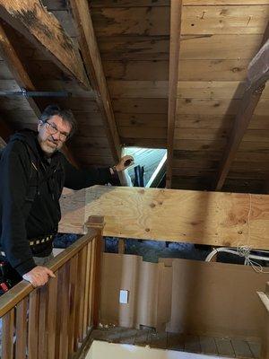 George pointing things out in the attic