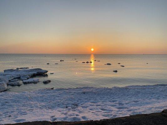 02/27/21 - Foster Avenue Beach just after sunrise, ice shelf on the left w/floating ice chunks in the lake