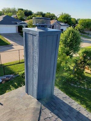 This chimney needed new trim,siding panels, and a new chase cover. It was paint matched to the home.