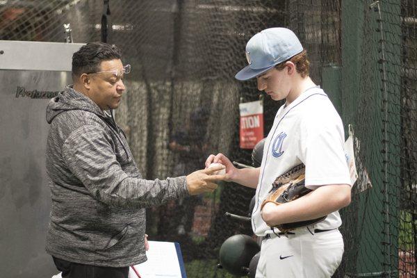 Rich "El Guapo" Garces works closely with a dedicated pitcher