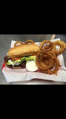 Ribeye steak sandwich and onion rings