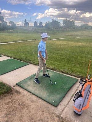 August on the driving range