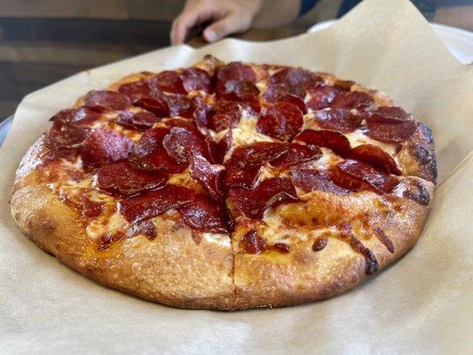 Triple pepperoni pizza