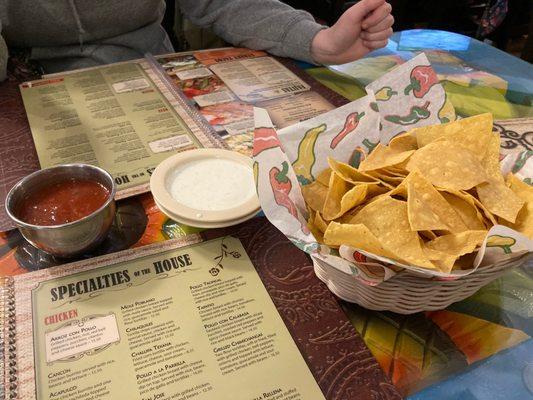 salsa blanca (white sauce), regular salsa, and chips