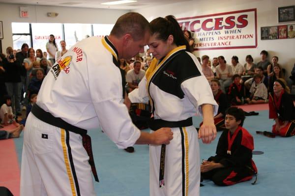 Master Lyndsay being awarded her 4th Degree Black Belt in Tae Kwon Do!