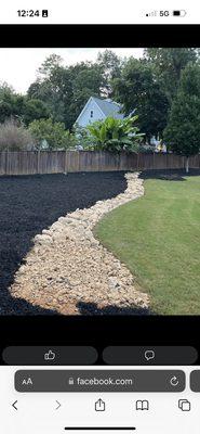 We laid 65 yards of black mulch in the front and back of this customers property as well as installed a dry bed creek notice the river rock.