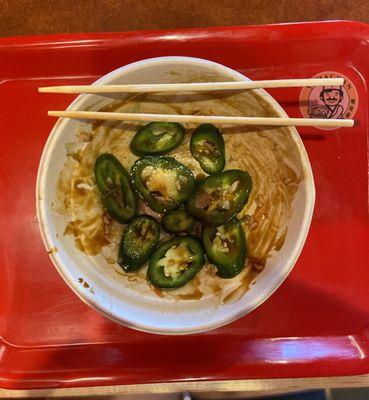 Half dollar sized jalapeño peppers in poke bowl