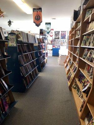 Comics located on the left side of the store when you walk in