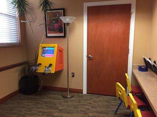 2019-01-16. Dr. Kolakowski. DDS. Macomb Twp. Kids corner. Small coloring station and a video game console for 2.