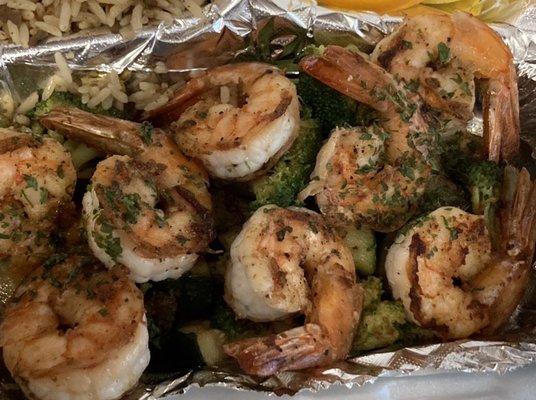 Grilled shrimp on bed of grilled broccoli and zucchini