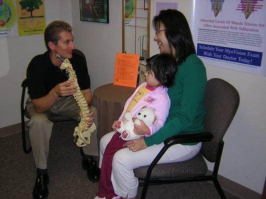 Dr. Dees consulting with new patients.