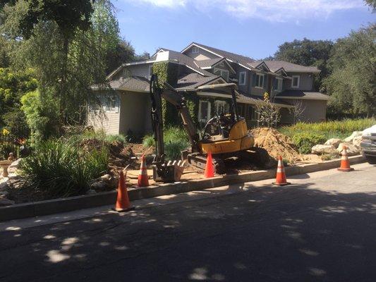 Excavating to connect private home to city sewer line. (La Canada)