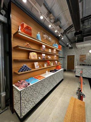 Interior of store across from the display of various ice cream.