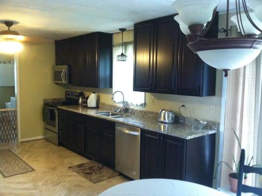 This kitchen no longer looks dated and the family loves the new look and practical lay-out.