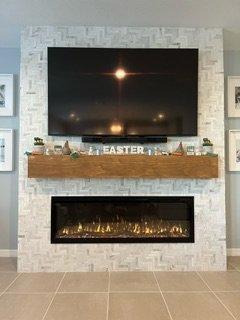 Building a small fireplace and mantle can change a room