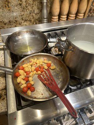 Gnocchi in fresh tomato, garlic and pancetta sauce