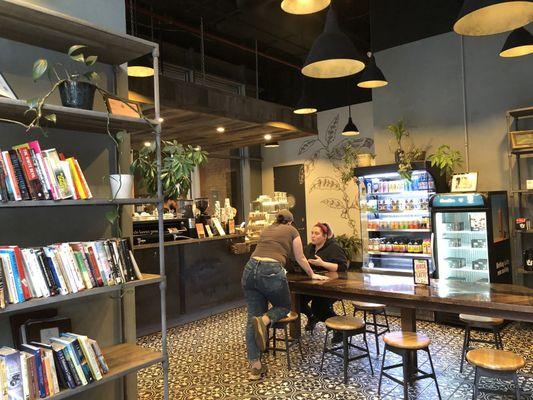 View of the coffee shop as you enter.  There's a free library of books on the left!