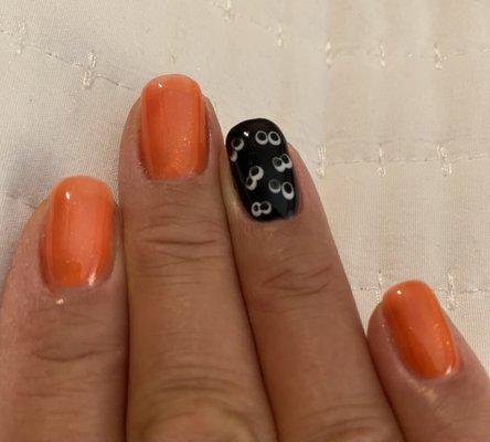 Getting ready for Halloween with orange cat eye polish (the picture doesn't show the cool lines) and hand-painted eyes.