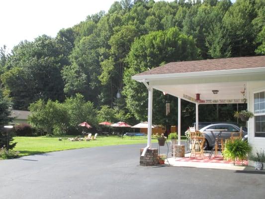 Hotel front desk along with a view of the various outside seating arrangements