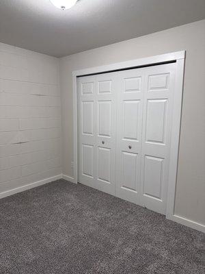 One bedroom with new bi fold closet doors