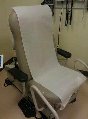 Midmark captains-chair style exam chair.