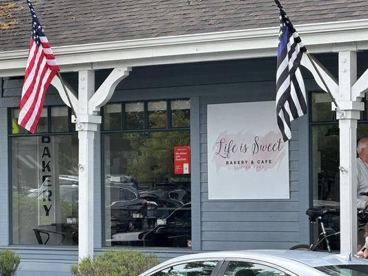 Life is Sweet bakery flies a thin blue line flag.