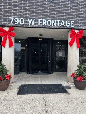 Holiday ribbons outside door.